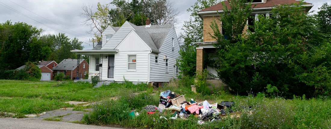 illegal-dumping illegal dumping on the curb in front of a vacant property